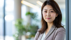 Confident Japanese businesswoman portrait at her office with copy space