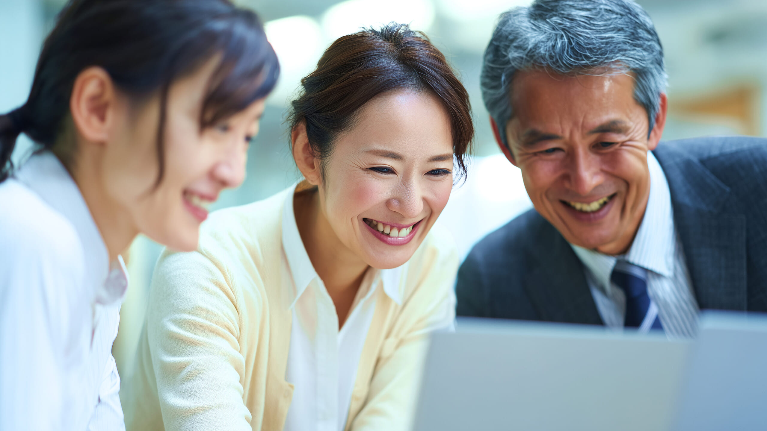Business people working together on laptop computer at office desk. asian